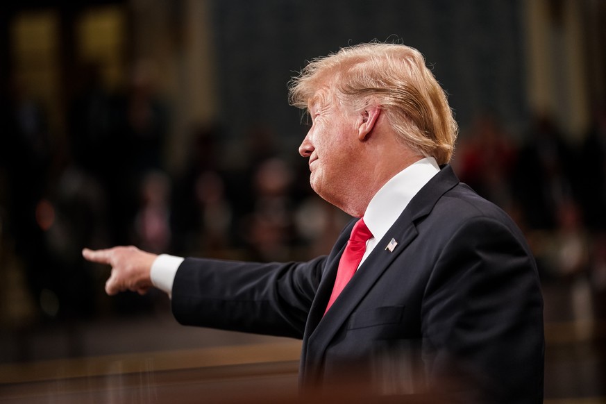 epa07346788 US President Donald J. Trump gestures as he delivers the State of the Union address, with Vice President Mike Pence and Speaker of the House Nancy Pelosi at the Capitol in Washington, DC,  ...