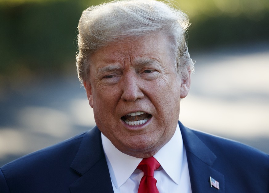 President Donald Trump speaks with reporters before boarding Marine One on the South Lawn of the White House, Tuesday, July 10, 2018, in Washington. (AP Photo/Evan Vucci)