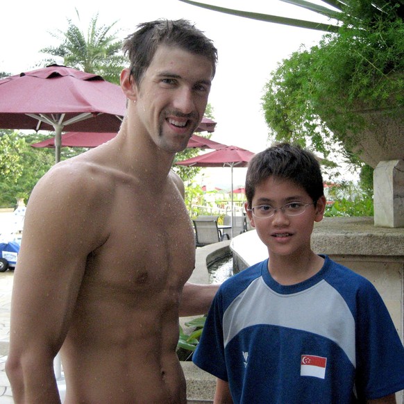 Singapore swimmer Joseph Schooling (R) poses with U.S. swimmer Michael Phelps during a training camp in Singapore in this 2008 photo released by the Schooling family August 13, 2016. May Schooling/Han ...
