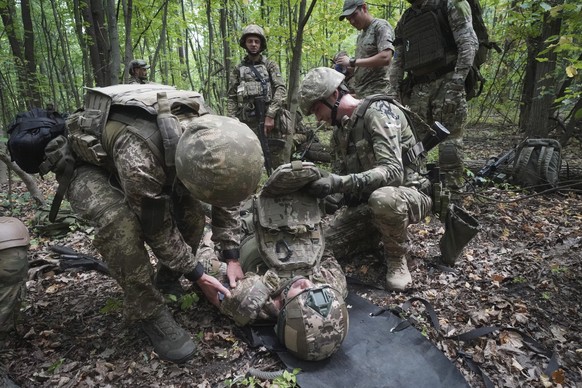 Ukrainian soldiers from the 3rd Spartan Task Force Brigade are taking part in tactical and medical training exercises at an undisclosed location in Kharkiv region, Ukraine, Monday, July 22, 2024. (AP  ...