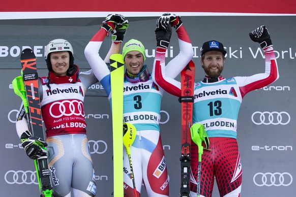 epa08122464 Winner Daniel Yule (C) of Switzerland , 2nd placed Henrik Kristoffersen (L) of Norway and 3rd placed Marco Schwarz (R) of Austria celebrate on the podium for the Men&#039;s Slalom race at  ...