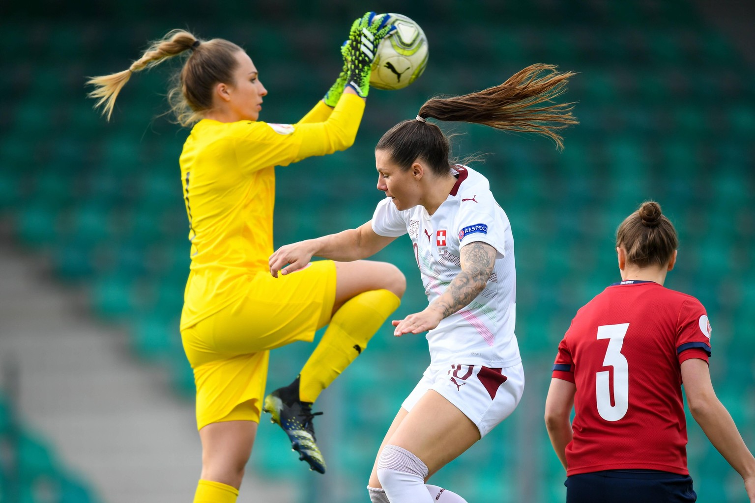 Chomutov, Czech Republic, April Ramona Bachmann 10 Switzerland jumps uf for a header against Goalkeeper Barbora Votikova 1 Czech Republic during the UEFA Womens Championship Qualifier Playoff game bet ...