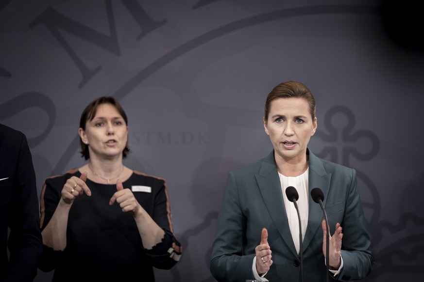 epa08283062 Danish Prime Minister Mette Frederiksen (R) holds a press briefing on the novel coronavirus Covid-19 situation, in Copenhagen, Denmark, 10 March 2020. Denmark announced on the day that it  ...