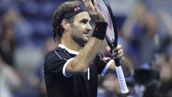 Roger Federer acknowledges the crowd after defeating Sumit Nagal during the first round of the U.S. Open tennis tournament in New York, Monday, Aug. 26, 2019. Federer won 4-6, 6-1, 6-1, 6-4. (AP Photo ...