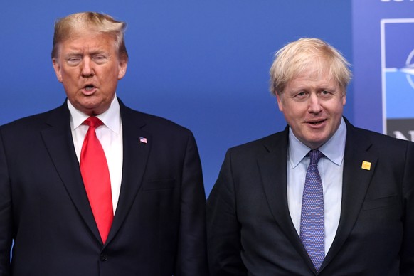 epa08043329 US President Donald Trump (R) poses with British Prime Minister Boris Johnson during the NATO Summit in London, Britain, 04 December 2019. NATO countries&#039; heads of states and governme ...
