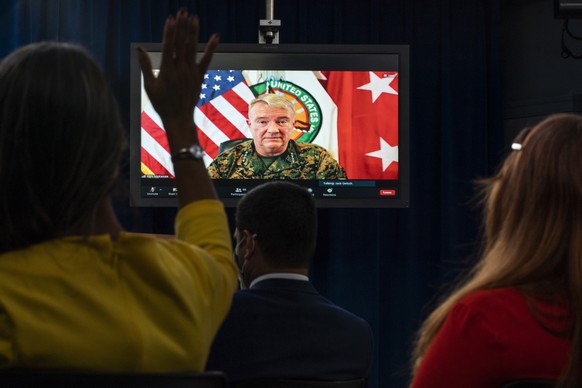Gen. Frank McKenzie, Commander of the U.S. Central Command, appearing on screen from MacDill Air Force Base, in Tampa, Fla., appears on a screen as he speaks about Afghanistan during a virtual briefin ...