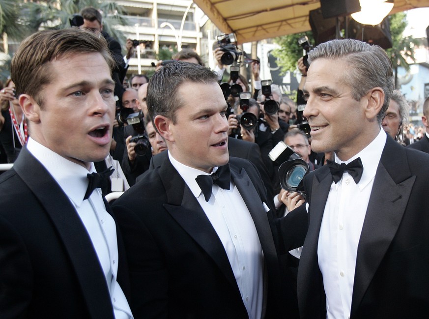 FILE - In this Thursday, May 24, 2007 file photo, American actors, from left, Brad Pitt, Matt Damon and George Clooney arrive for the screening of the film &quot;Ocean's Thirteen,&quot; at the 60th In ...