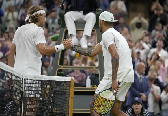 Australia&#039;s Nick Kyrgios shakes hands at the net with Greece&#039;s Stefanos Tsitsipas after winning their third round men&#039;s singles match on day six of the Wimbledon tennis championships in ...