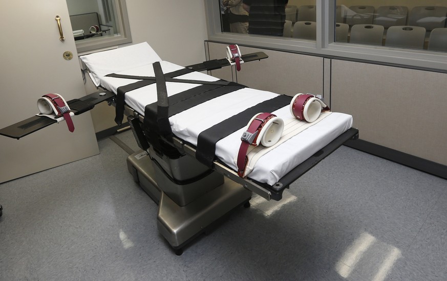 FILE - This Oct. 9, 2014, file photo shows the gurney in the the execution chamber at the Oklahoma State Penitentiary in McAlester, Okla. A state with one of the busiest death chambers in the country  ...