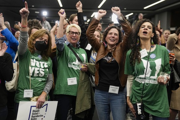 From left, Sandra Feihrer, Lauren Angler, Shannon Gallagher and Tina Gasbarra Larsen celebrate with other supporters at an Issue 1 watch party Tuesday, Nov. 7, 2023, in Columbus Ohio. Ohio voters have ...