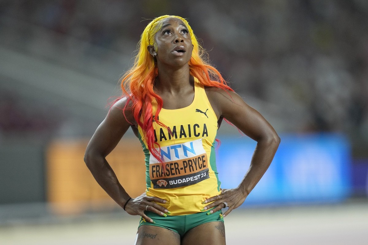 Shelly-Ann Fraser-Pryce, of Jamaica, reacts after she won her women's 100 meter semifinal heat during the World Athletics Championships in Budapest, Hungary, Monday, Aug. 21, 2023. (AP Photo/Ashl ...