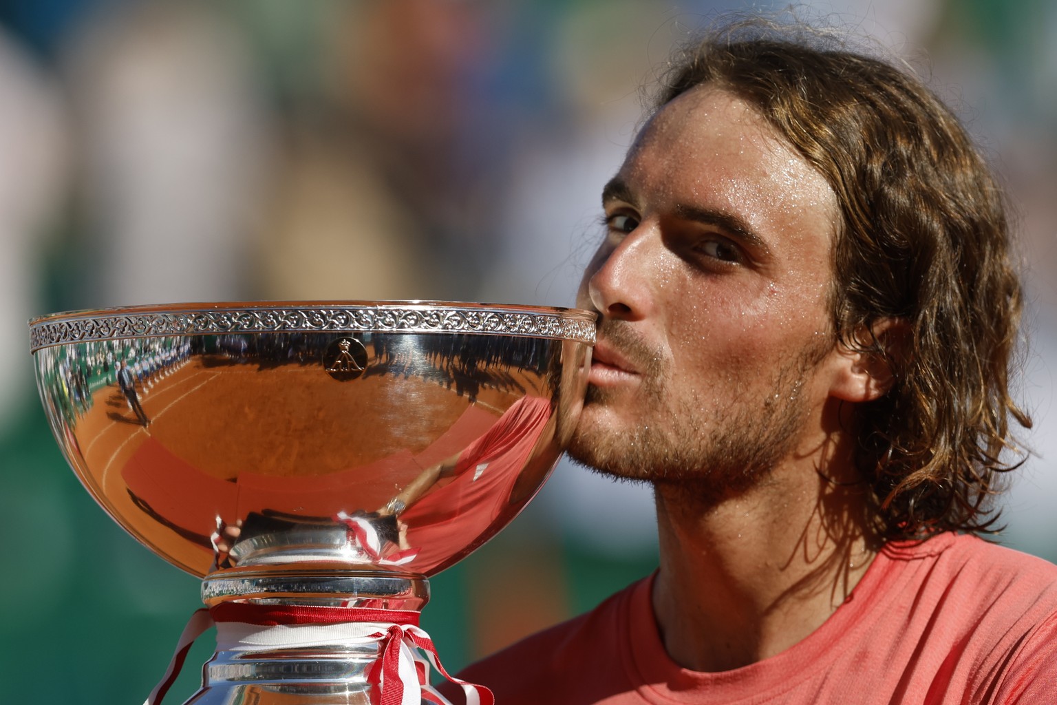 epa11278418 Stefanos Tsitsipas of Greece poses with his trophy after winning his final match against Casper Ruud of Norway in their final match at the ATP Monte Carlo Masters tournament in Roquebrune  ...
