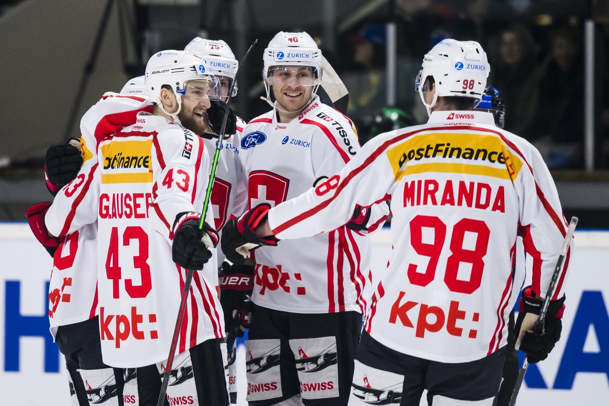 Switzerland's players celebrate after oa goal during a friendly ice hockey match between France and Switzerland, at the Palais des Sports stadium, in Megeve, France, Friday, April 15, 2022. (KEYS ...