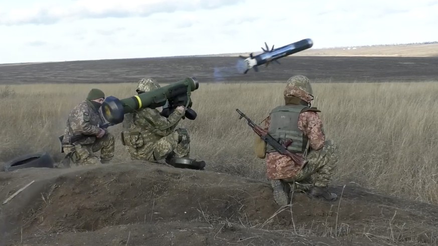 FILE - In this image taken from footage provided by the Ukrainian Defense Ministry Press Service, a Ukrainian soldiers use a launcher with US Javelin missiles during military exercises in Donetsk regi ...
