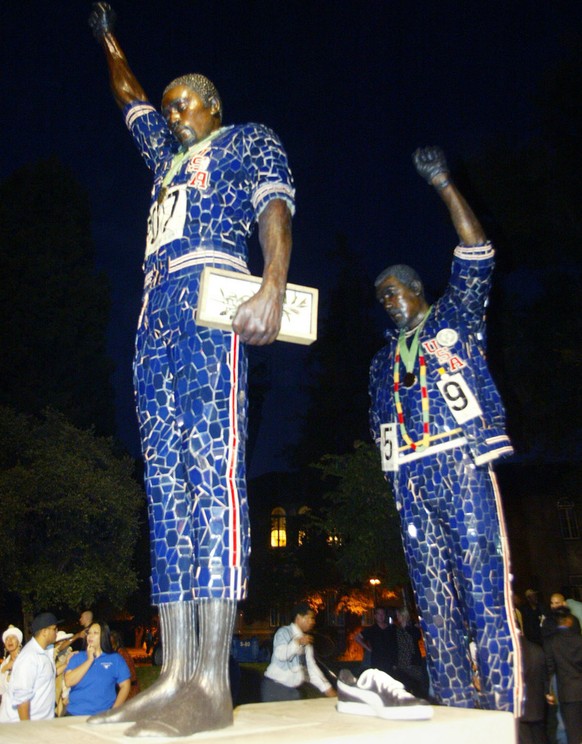 A statue in honor of former Olympians Tommie Smith, left, and John Carlos is seen after being unveiled, Monday Oct. 17, 2005, in San Jose, Calif. Smith and Carlos raised gloved fists and dropped their ...