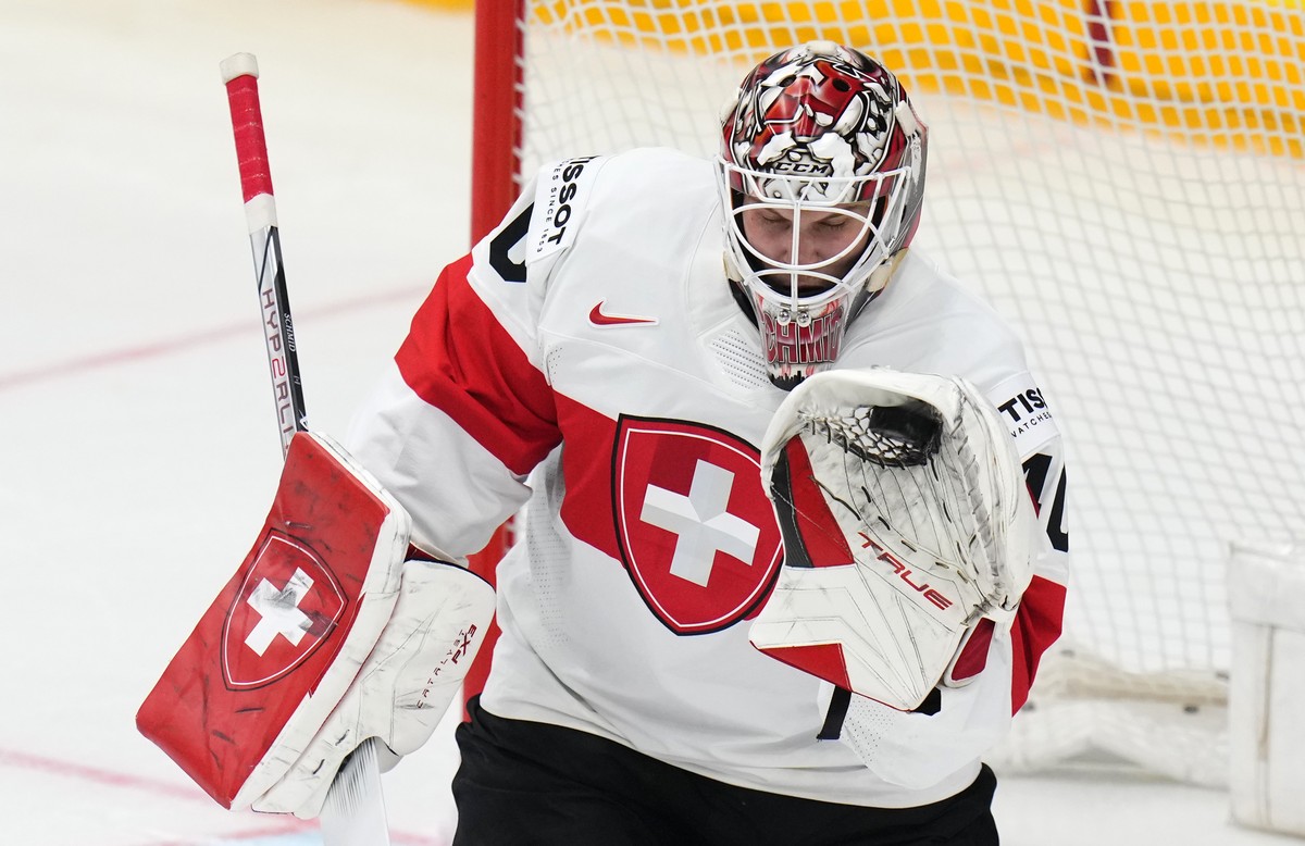 Switzerland's Akira Schmid makes a save during the preliminary round match between Finland and Switzerland at the Ice Hockey World Championships in Prague, Czech Republic, Tuesday, May 21, 2024.  ...