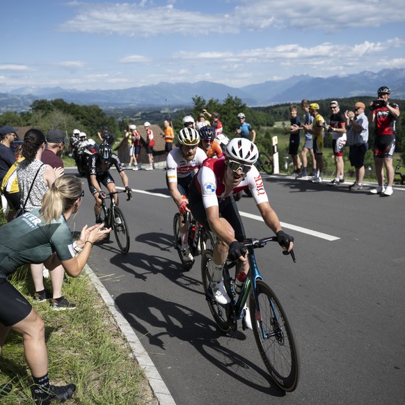 Simon Vitzthum from Switzerland of Swiss Cycling, front, and Quinn Simmons from USA of Trek-Segafredo climb the &quot;Pfannenstiel&quot; pass during the first stage, a 178 km race with start and finis ...