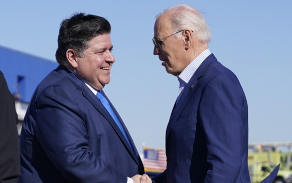 President Joe Biden greets Illinois Gov. JB Pritzker as he arrives at Chicago Rockford International Airport, Thursday, Nov. 9, 2023, in Rockford, Ill. (AP Photo/Evan Vucci)
Joe Biden