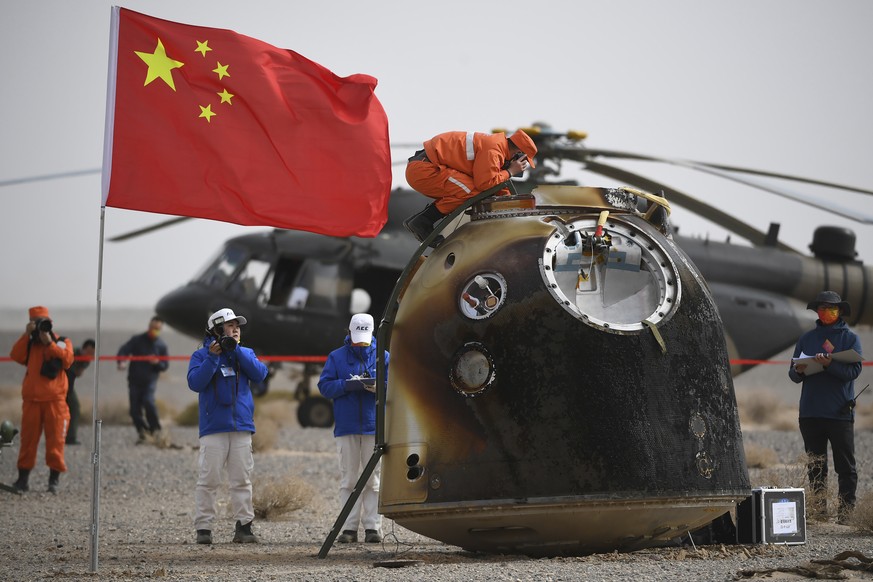In this photo released by China&#039;s Xinhua News Agency, the return capsule of the Shenzhou-13 manned space mission is seen after landing at the Dongfeng landing site in northern China&#039;s Inner  ...