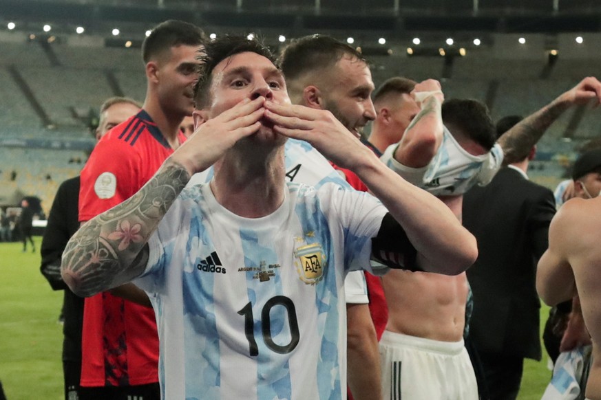 epa09336525 Lionel Messi of Argentina blows a kiss to celebrate their win against Brazil after the Copa America final soccer match at Maracana Stadium in Rio de Janeiro, Brazil, 10 July 2021. EPA/ANDR ...