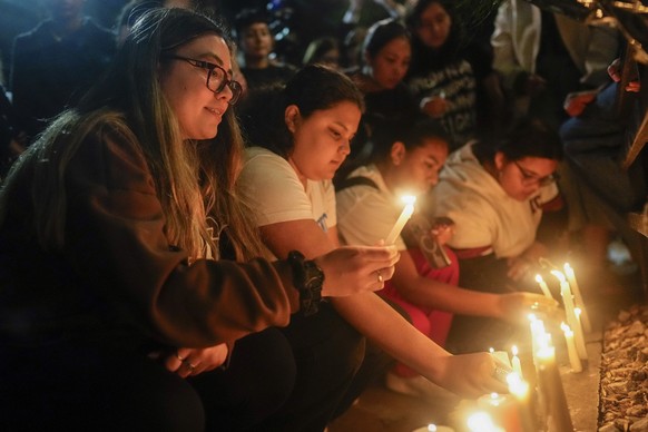 Fans light candles outside the hotel where former One Direction singer Liam Payne was found dead after he fell from a balcony in Buenos Aires, Argentina, Wednesday, Oct. 16, 2024. (AP Photo/Natacha Pi ...