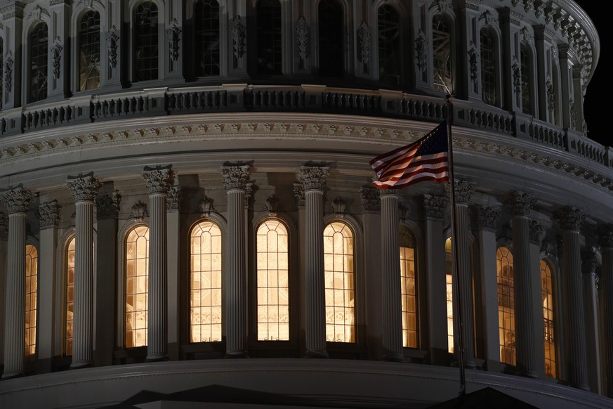 Light shines from inside the U.S. Capitol dome in Washington, late Tuesday, Nov. 12, 2019. The public impeachment inquiry hearings set to begin Wednesday will pit a Democratic attorney who built his r ...