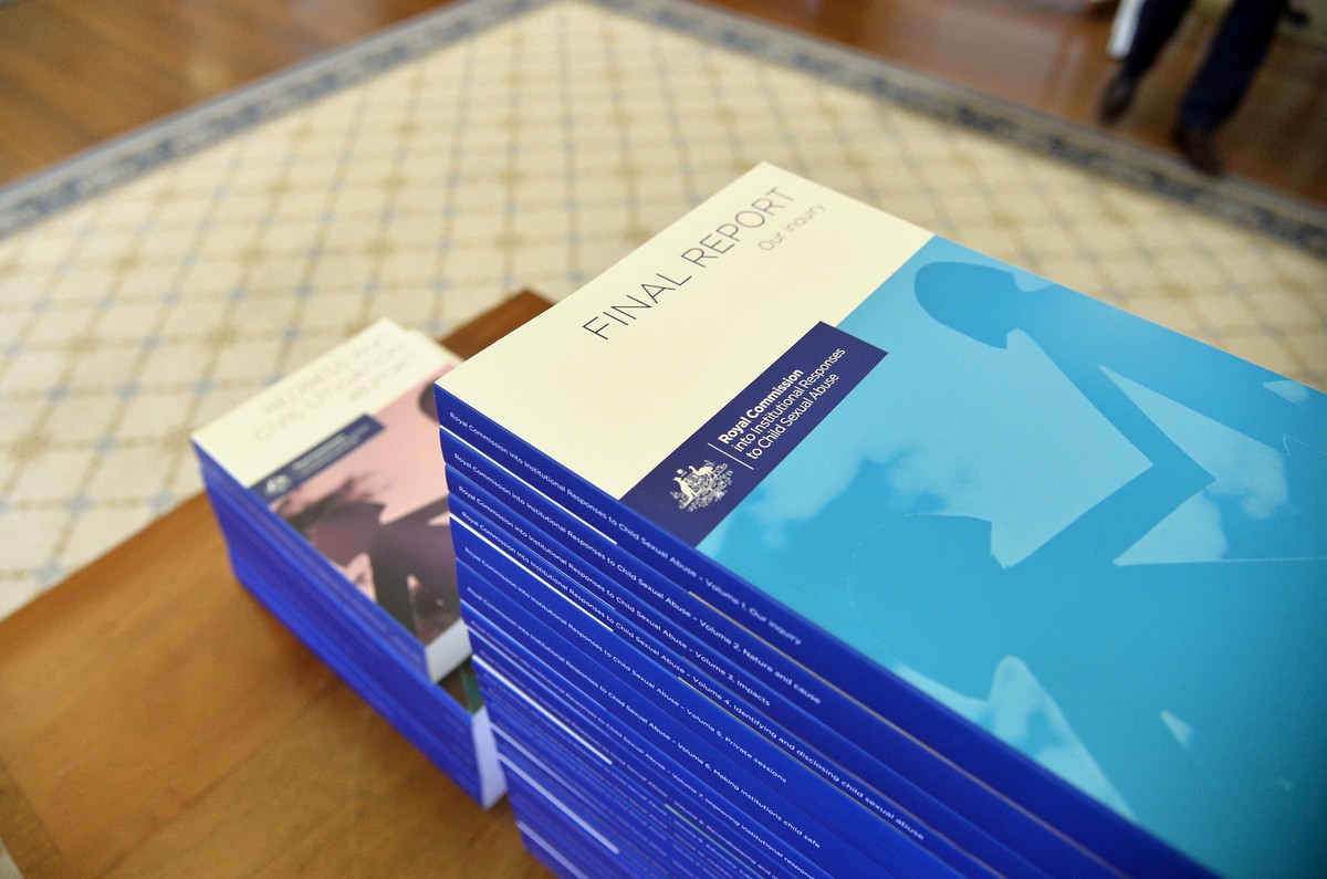 epa06390568 A handout photo made available by the Royal Commission into Institutional Responses to Child Sexual Abuse shows the volumes of the Final Report of the Royal Commission into Institutional R ...