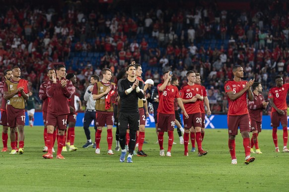 epa09450446 Switzerland players react at the end of the 2022 FIFA World Cup European Qualifying Group C soccer match between Switzerland and Italy in the St. Jakob-Park stadium in Basel, Switzerland,  ...