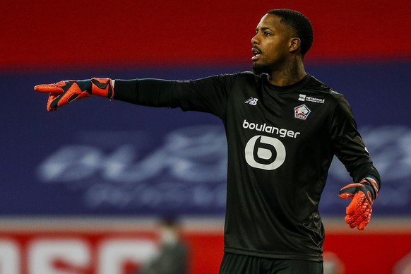 Lille&#039;s goalkeeper Mike Maignan gestures during the French League One soccer match between Lille and Brest at the Stade Pierre Mauroy stadium in Villeneuve d&#039;Ascq, northern France, Sunday, F ...