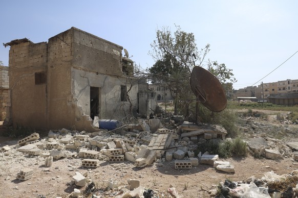 A building destroyed in the shelling from the Syrian government positions is seen in Idlib, Syria, Friday, Oct. 6, 2023. (AP Photo/Ghaith Alsayed)