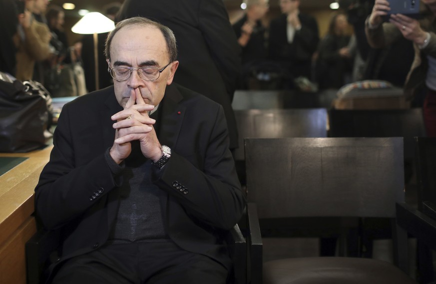 Cardinal Philippe Barbarin waits for the start of his trial at the Lyon courthouse, central France, Monday Jan. 7, 2019. Cardinal Barbarin and five others are going on trial in France accused of cover ...