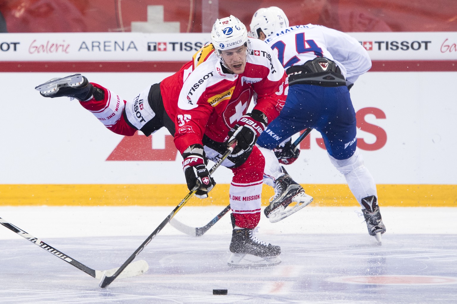 Switzerland&#039;s Gaetan Haas, left, fights for the puck with France&#039;s Olivier Dame Malka, right, during the Swiss Ice Hockey Challenge 2016 between Switzerland and France, at the Tissot Arena i ...