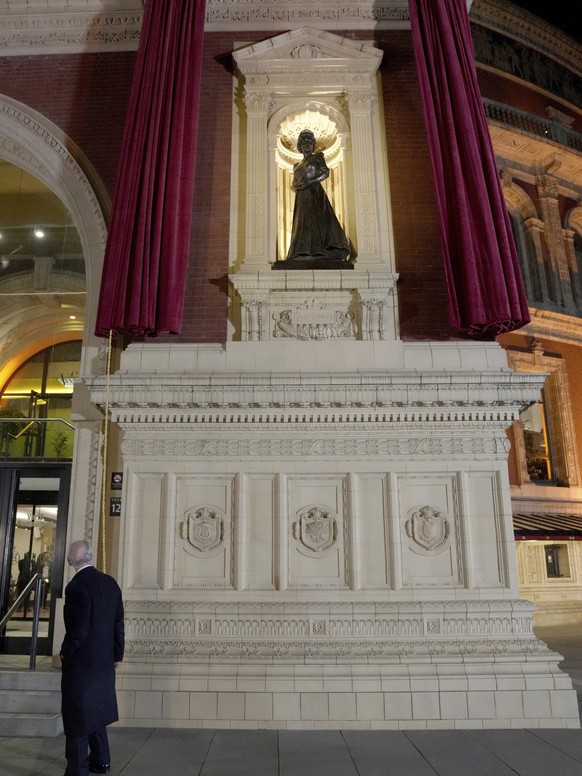 Britain&#039;s King Charles unveils a statue of Queen Elizabeth II as he arrives to attend The Royal British Legion Festival of Remembrance at Royal Albert Hall, London, Saturday Nov. 11, 2023. (Maja  ...