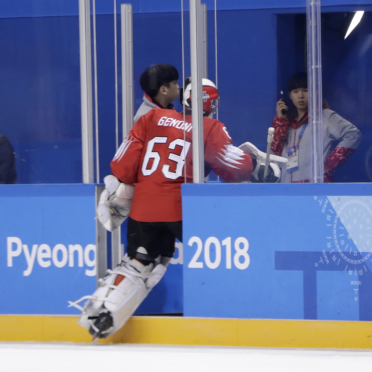 Switzerland goalkeeper Leonardo Genoni leaves the ice after allowing four goals to Canada during the second period of a preliminary round men's hockey game at the 2018 Winter Olympics in Gangneun ...