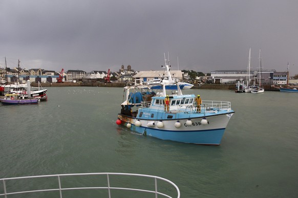 A French trawler coming from the British waters arrives at the port of Granville, Normandy, Monday, Nov. 1, 2021. France has threatened to bar British boats from some of its ports and tighten checks o ...