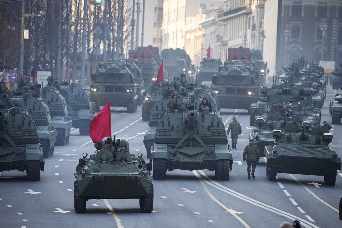 FILE - Russian self-propelled artillery vehicles, tanks and military vehicles roll along Tverskaya street toward Red Square to attend a rehearsal for the Victory Day military parade in Moscow, Russia, ...