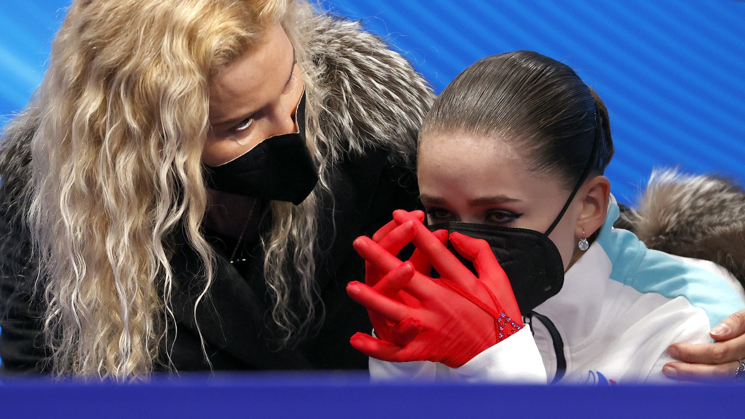 epa09766590 Kamila Valieva of Russian Olympic Committee cries next her coach Eteri Tutberidze (L) after the Women&#039;s Free Skating of the Figure Skating events at the Beijing 2022 Olympic Games, Be ...