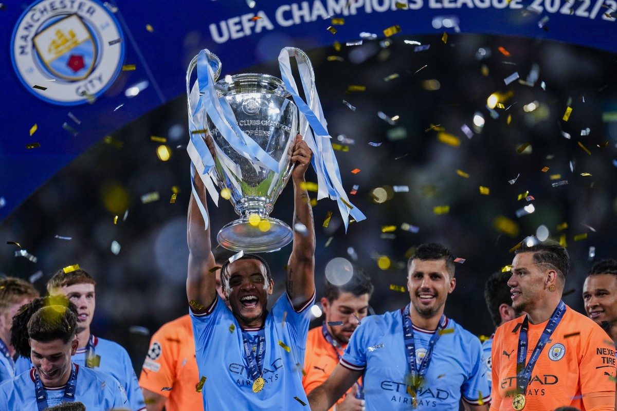 Manchester City's Manuel Akanji holds the trophy after winning the Champions League final soccer match between Manchester City and Inter Milan at the Ataturk Olympic Stadium in Istanbul, Turkey,  ...