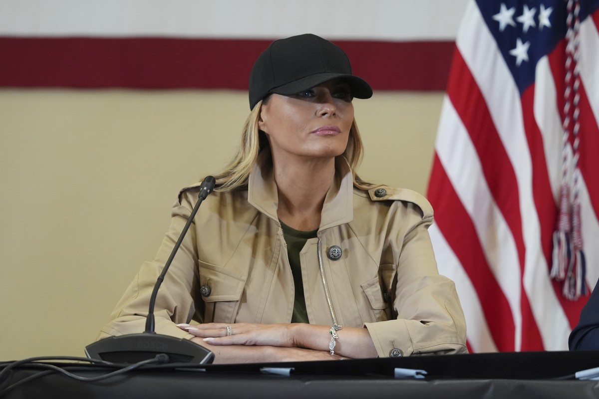 First lady Melania Trump wears a Camp Mystic charm bracelet that she says was gifted to her in honor of the girls who died in the flooding at Camp Mystic, during a roundtable discussion with first res ...