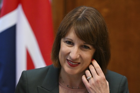 Britain&#039;s Chancellor of the Exchequer Rachel Reeves cheers a meeting of the National Wealth Fund Taskforce at 11 Downing Street in London, Tuesday, July 9, 2024. (Justin Tallis/Pool Photo via AP)