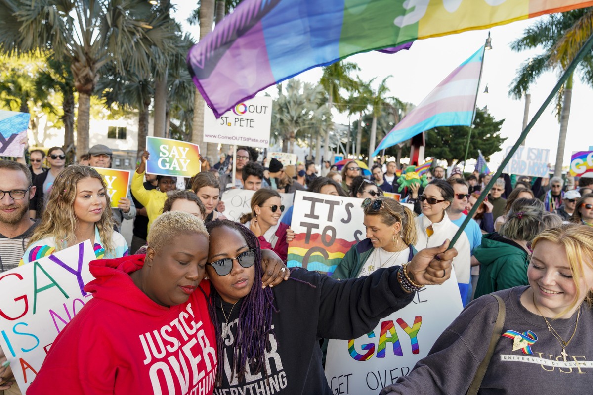 FILE - Florida House Representative Michele Rayner, left, hugs her spouse, Bianca Goolsby, during a march at city hall in St. Petersburg, Fla., on March 12, 2022, to protest the controversial "Do ...
