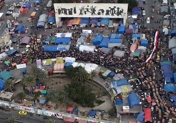 epa08262883 An aerial picture taken by a drone shows Iraqi protesters at the Al-Tahrir square in central Baghdad, Iraq, 01 March 2020. Thousands of Iraqis continue their protests in Baghdad and southe ...