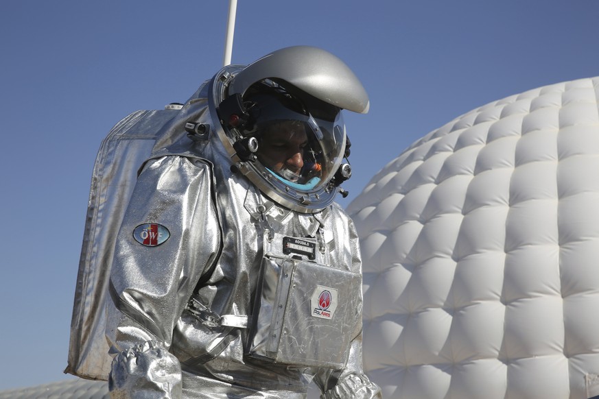 This Feb. 7, 2018, photo shows analog astronaut Kartik Kumar wearing an experimental space suit during a simulation of a future Mars mission in the Dhofar desert of southern Oman. The desolate desert  ...