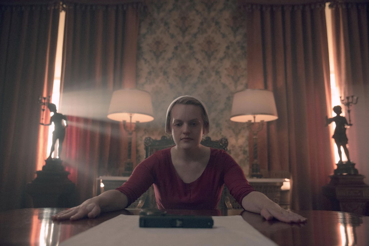 This image released by Netflix shows Elisabeth Moss in a scene from "The Handmaid's Tale." The program was nominated for an Emmy Award for outstanding drama series on Tuesday, July 28,  ...