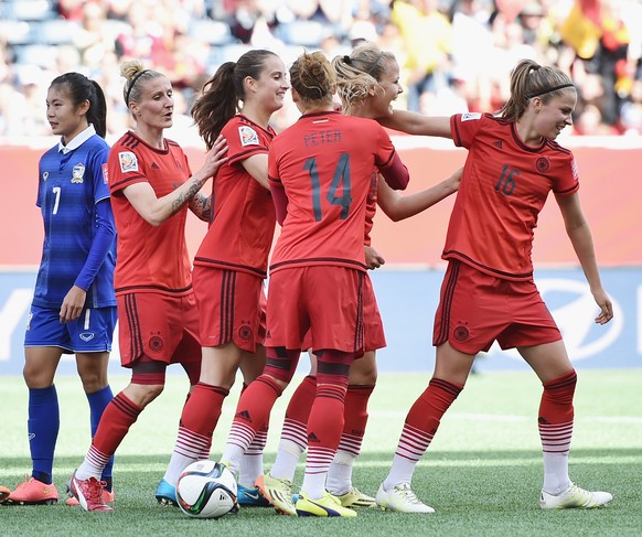 WINNIPEG, MB - JUNE 15: Lena Petermann of Germany celebrates with team mates as she heads the third goal during the FIFA Women&#039;s World Cup Canada 2015 Group B match between Thailand and Germany a ...