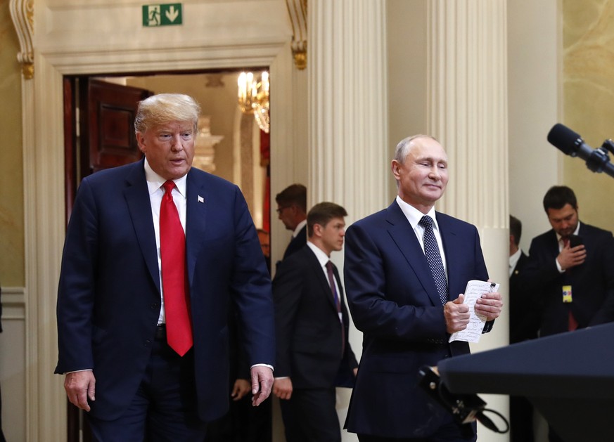 In this July 16, 20198, photo, U.S. President Donald Trump, left, and Russian President Vladimir Putin arrive for a news conference at the Presidential Palace in Helsinki, Finland. Trump has asked nat ...