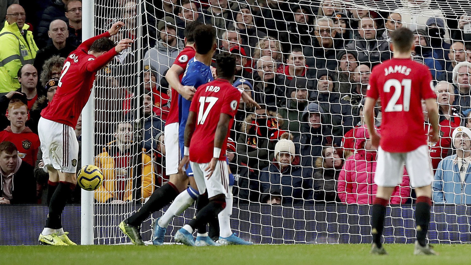 Manchester United&#039;s Victor Lindelof, left, scores an own goal, giving Everton their first goal of the game during the English Premier League match between Manchester United and Everton at Old Tra ...