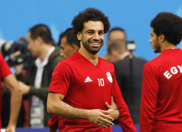 Egypt&#039;s Mohamed Salah smilies during Egypt&#039;s official training on the eve of the group A match between Russia and Egypt at the 2018 soccer World Cup in the St. Petersburg stadium in St. Pete ...
