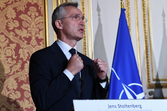 epa09633726 NATO Secretary General Jens Stoltenberg speaks during a press conference with French Foreign Affairs Minister and French Defence Minister after their meeting in Paris, France, 10 December  ...