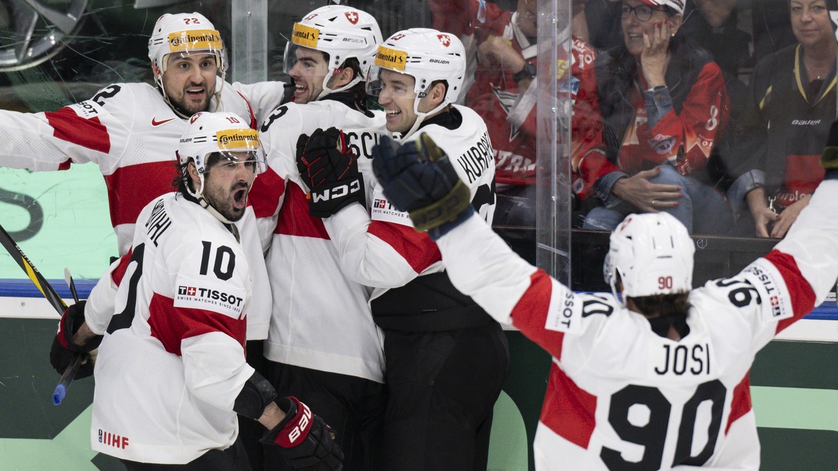 Switzerland's Andres Ambuehl, Nino Niederreiter, Nico Hischier, Philipp Kurashev and Roman Josi, from left, celebrate their goal to 6-5 during the Ice Hockey World Championship group A preliminar ...